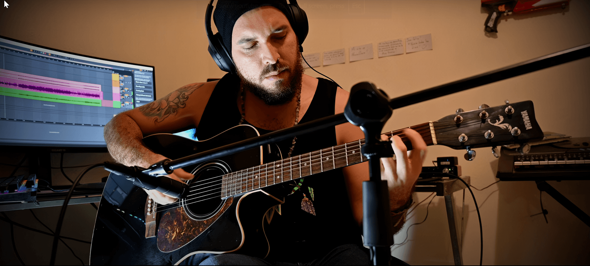 Nightsyrc playing Yamaha acoustic guitar