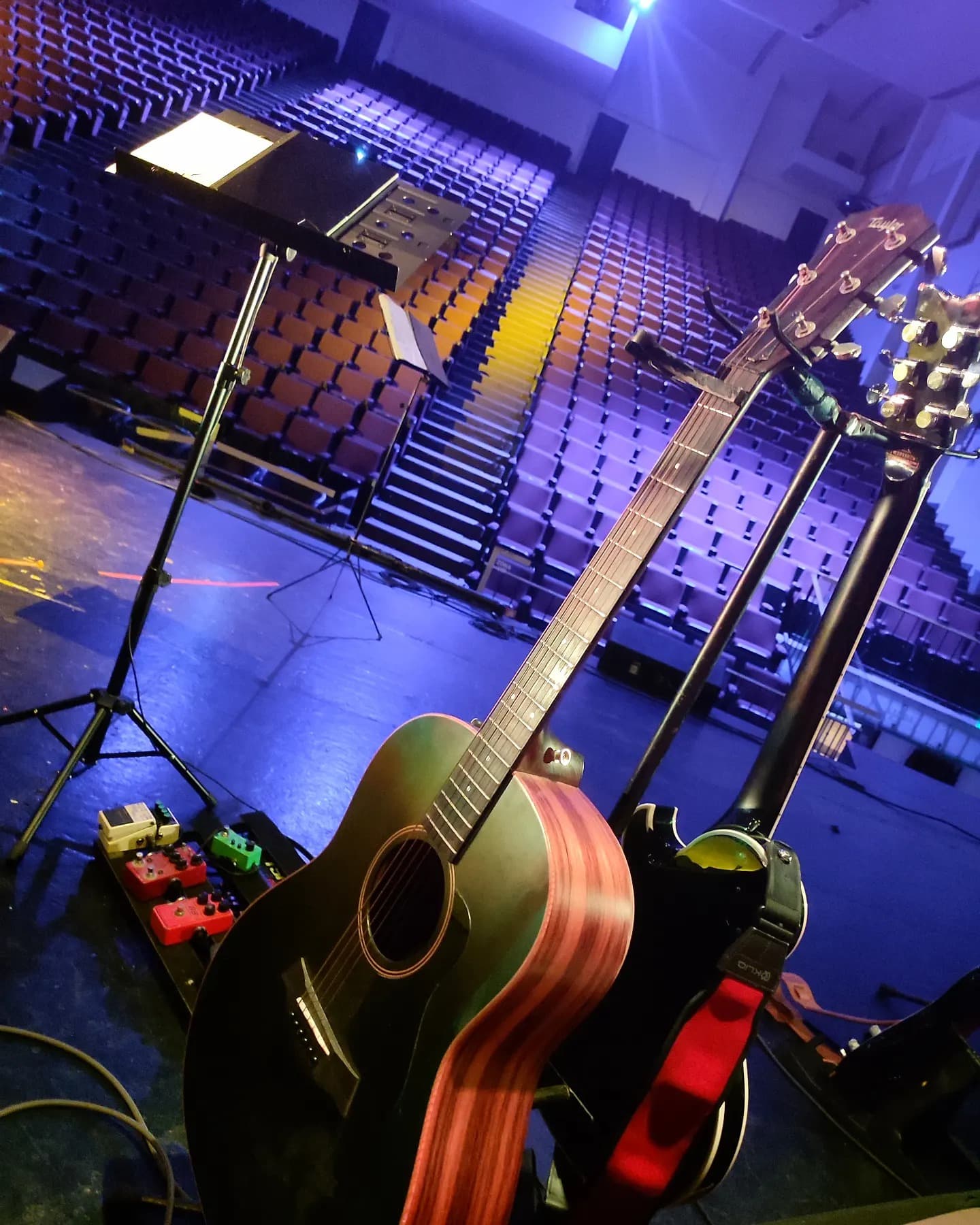 Guitarist on stage at Teatro Vallarta — Taylor AD17e & Schecter Solo II Custom